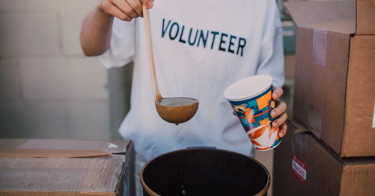 Volunteer serving hot meals at St. John's Soup Kitchen in Newark, New Jersey